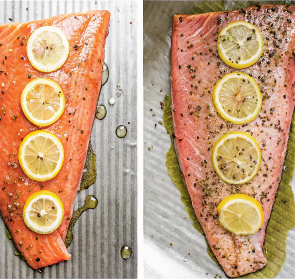 Photo of trout fillet on a baking tray seasoned with salt, pepper, and lemon slices after cooking