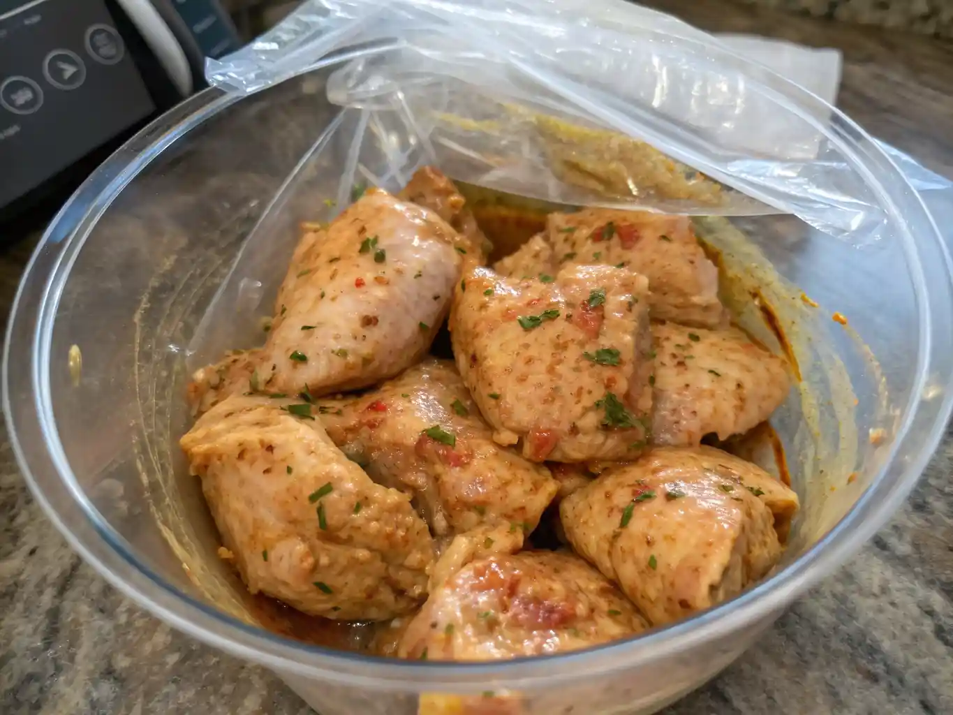 Marinated chicken resting in the fridge to absorb flavor for grilled nuggets