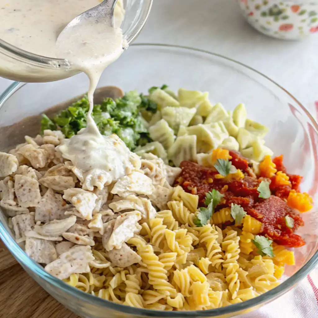 In a large bowl mix all the ingredients with the prepared sauce for recipe Chicken Bacon Ranch Pasta Salad